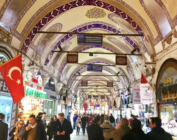 The painted vaulted corridor of the Grand Bazaar, lined with shops