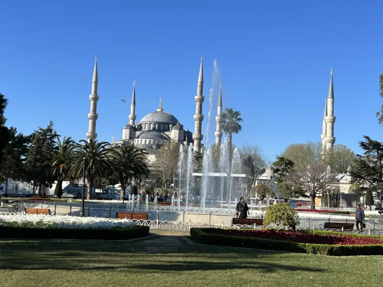 The Blue Mosque and its minarets seen across the fountain and gardens of Sultanahmet