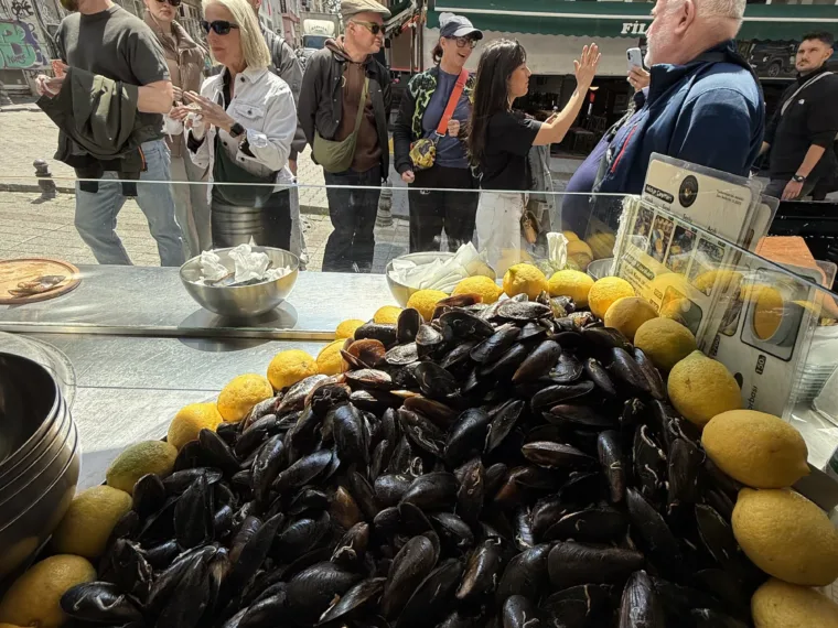 A street stall piled with black mussels and lemons in Istanbul