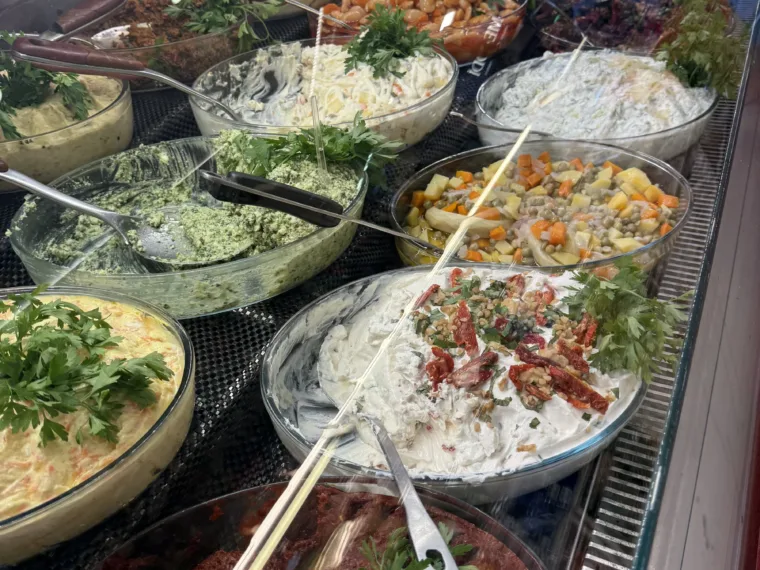 Trays of meze and salads along a deli counter in Istanbul