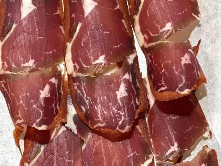 Whole pastırma laid out on the counter at a butcher in Istanbul