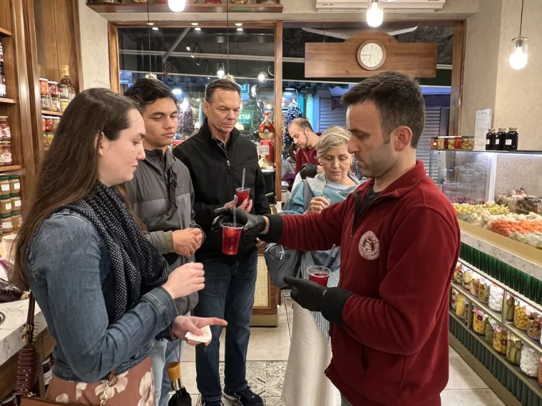Guests being served at a delicatessen counter on the Istanbul Evening Food Tour
