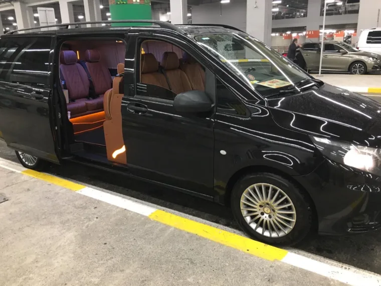 The Mercedes Vito used for airport transfers, with its side door open