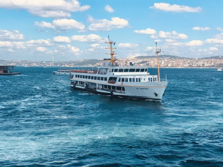 A Sehir Hatlari ferry crossing the Bosphorus under a blue sky