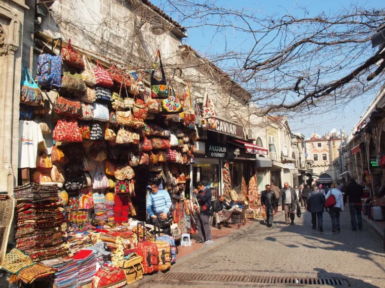 A busy Istanbul shopping street lined with lanterns and souvenir stalls