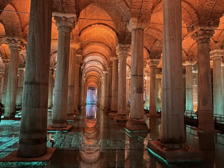 Lit columns and their reflections in the water of the Basilica Cistern