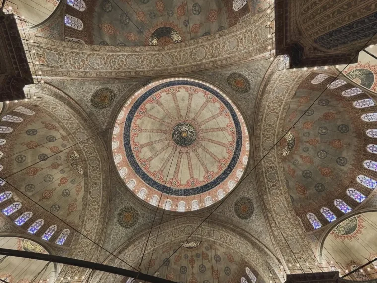 The painted dome and Iznik tiles inside the Blue Mosque