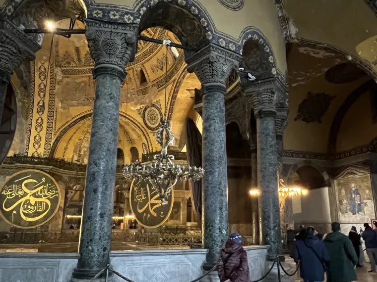 Marble columns and gold calligraphy roundels inside Hagia Sophia