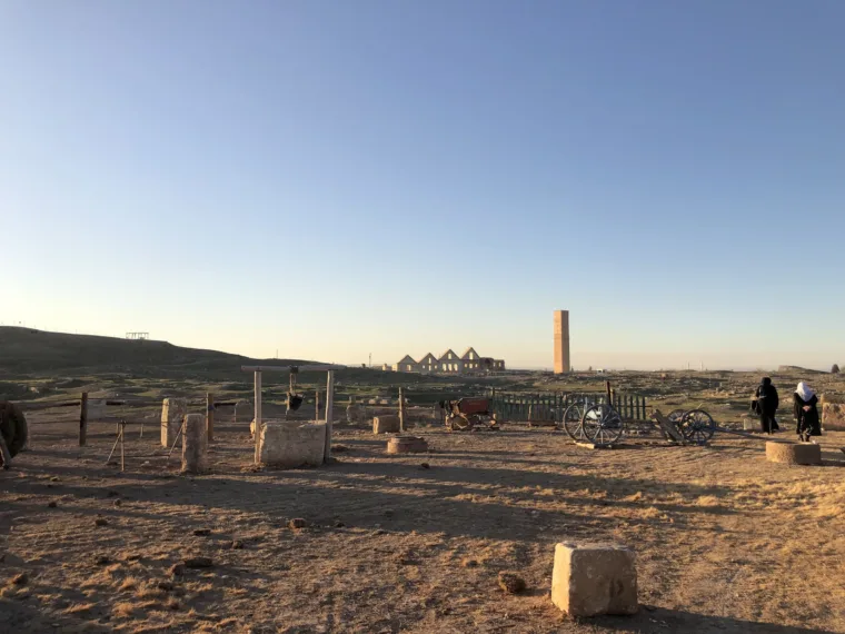 The ruins of Harran at dusk, with the tower on the horizon