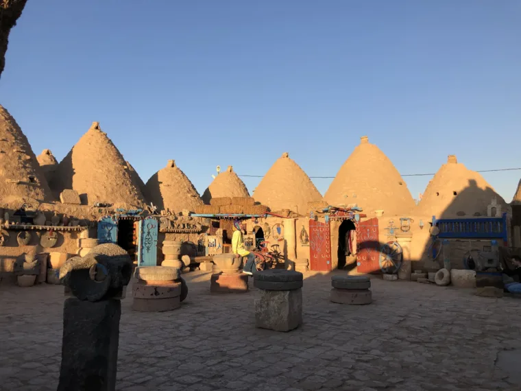 A row of conical mud brick roofs at Harran under a clear sky