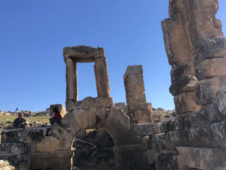 Weathered stone columns and cut blocks at an ancient site in southeastern Turkey