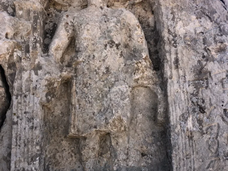 A robed figure carved in relief into the rock at an ancient site in southeastern Turkey