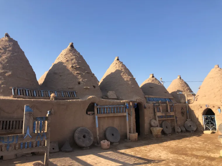 The blue painted doors and cartwheels of the Harran beehive houses