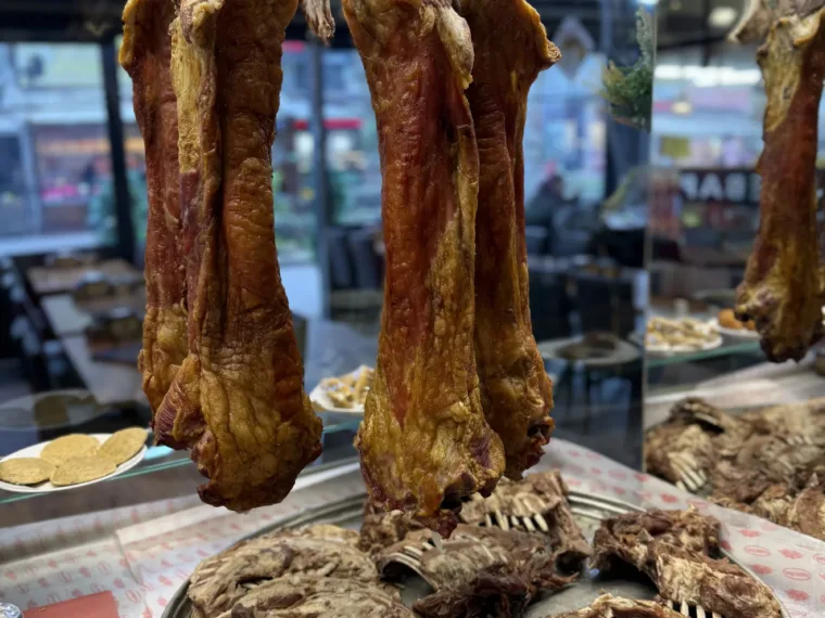 Buryan lamb hanging over the tray at the lunch stop on the Istanbul Off the Beaten Path tour