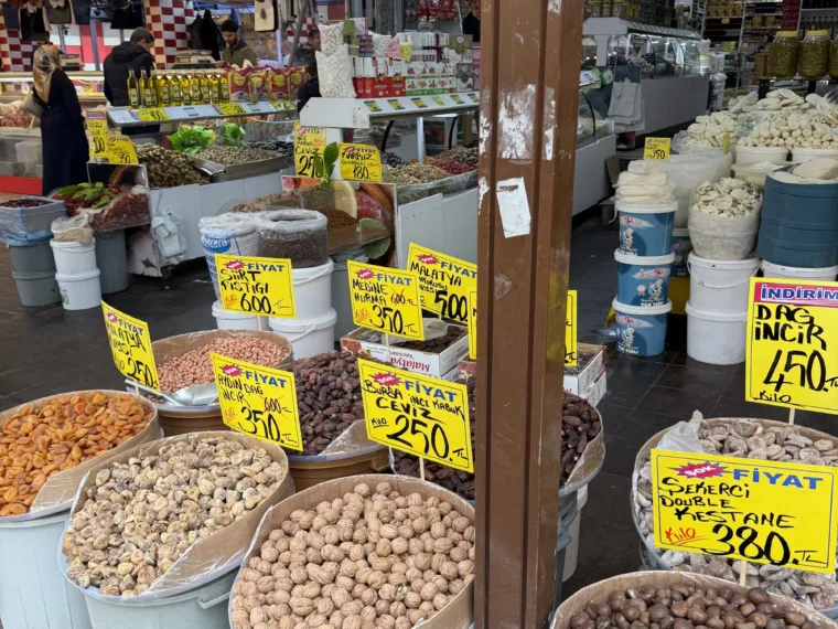 Tubs of nuts and pulses with handwritten price tags at the Women's Market in Istanbul
