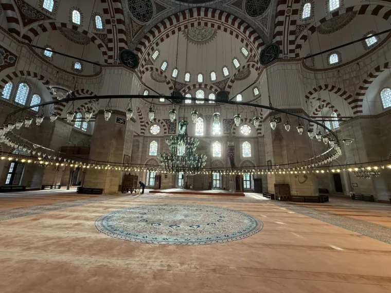 The prayer hall and carpet under the main dome of the Sehzade Mosque in Istanbul