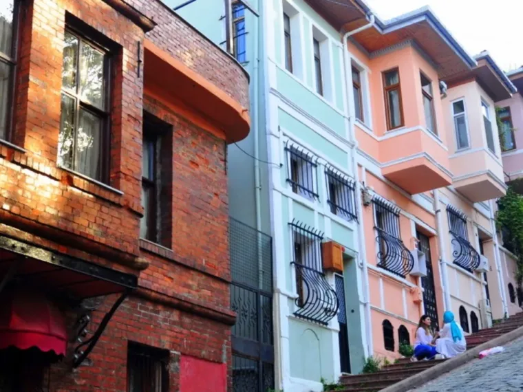 Pastel painted terraced houses on a steep Fener street
