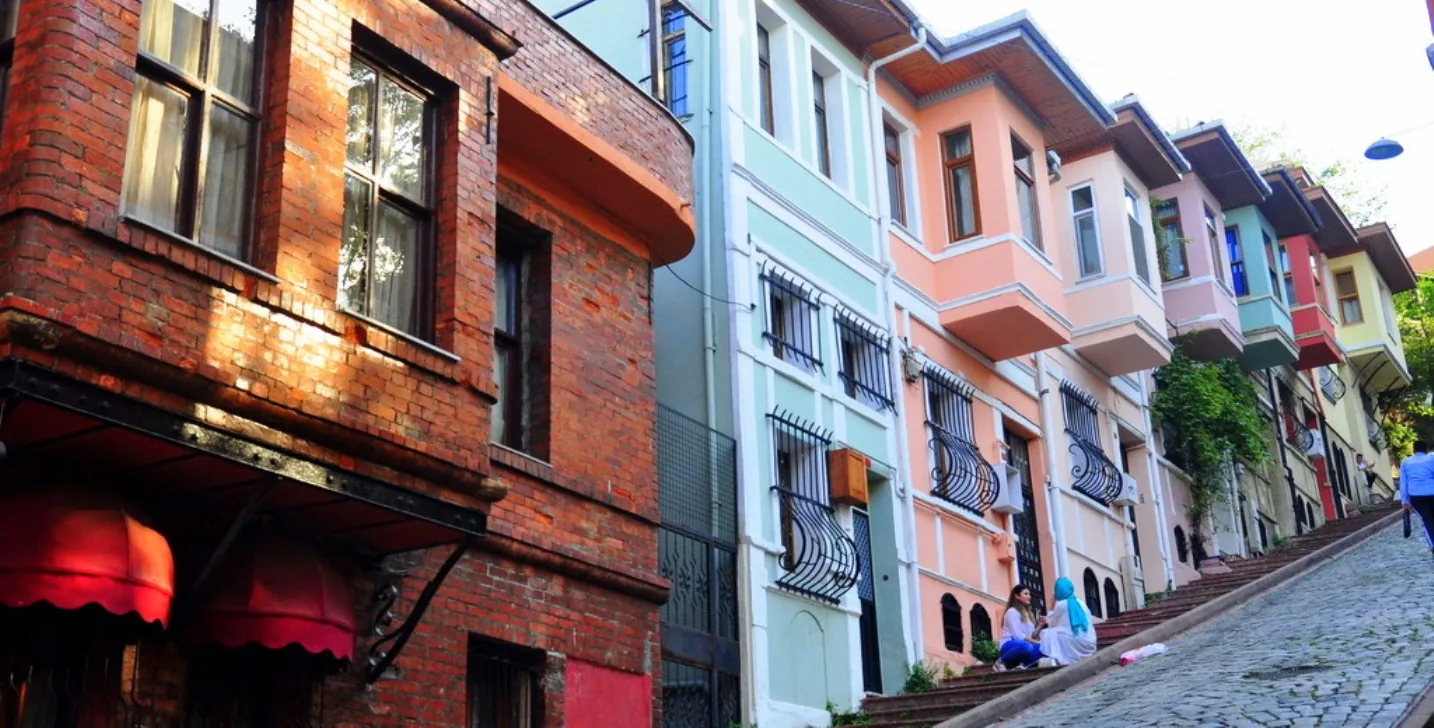Pastel painted terraced houses on a steep Fener street